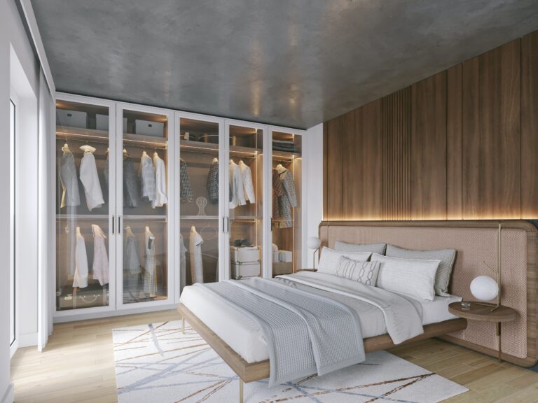 A modern bedroom with a bed and closets.