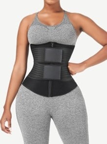 A woman wearing a grey and black body shaper.