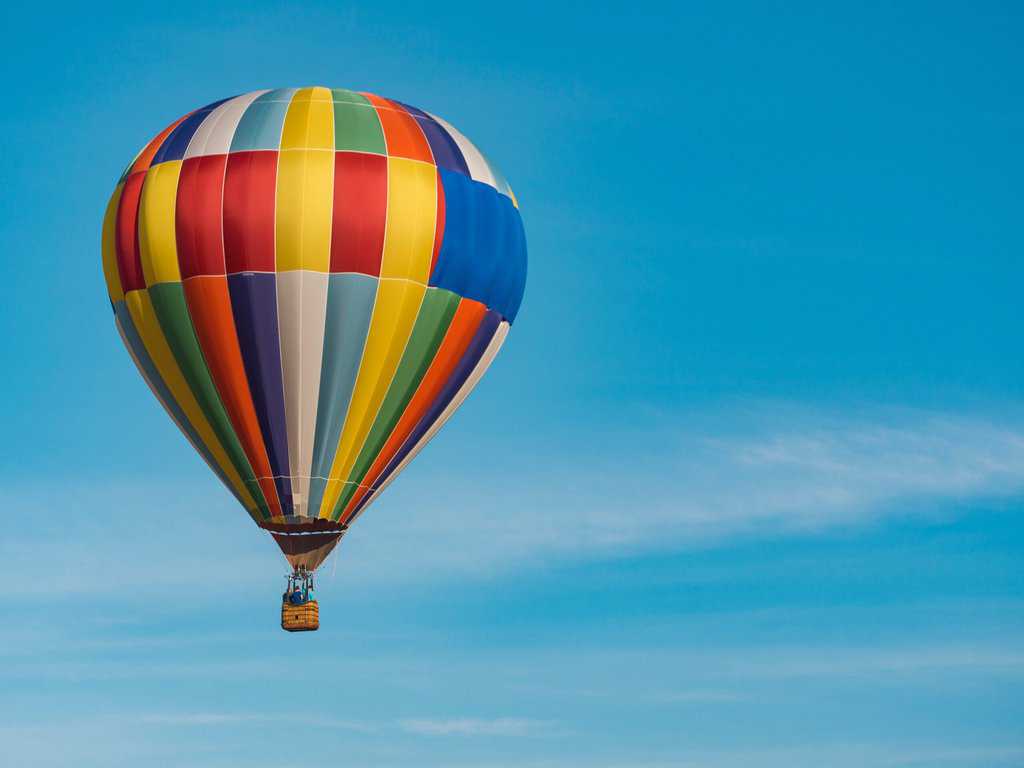 A hot air balloon flying in the sky.