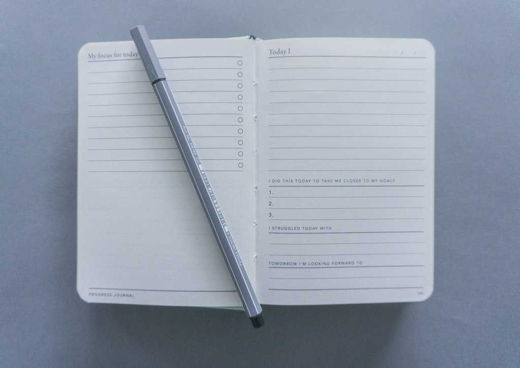 A notebook and pen, perfect for parents working at home, with helpful tips.